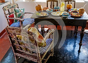 Colorful table and furniture in Sri Lanka Villa, covered with variety of natural healthy food with fruit on terrace