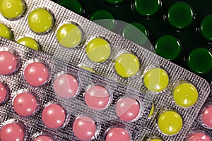 Colorful tablets and capsules in blister pack closeup