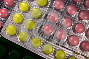 Colorful tablets and capsules in blister pack closeup