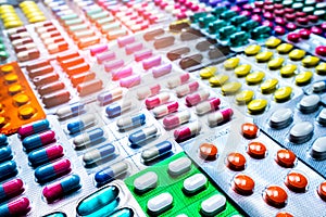 Colorful of tablets and capsules pill in blister packaging arranged with beautiful pattern. Pharmaceutical industry. photo