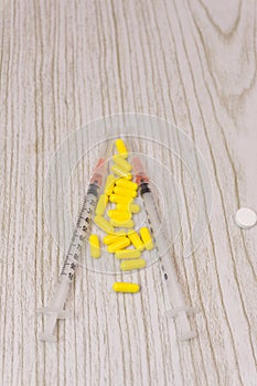 Colorful of tablets and capsules pill in blister packaging arranged with beautiful pattern with flare light. Pharmaceutical indust