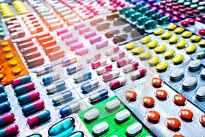 Colorful of tablets and capsules pill in blister packaging arranged with beautiful pattern. Pharmaceutical industry.