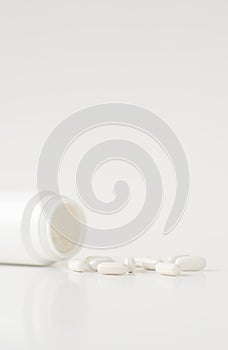 Colorful tablets, pills, drugs isolated on white background. Medication and healthcare concept. Close up, copy space, selective fo