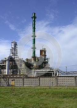 Colorful tall pipes, gas pipelines, tanks, ladders and other equipment for oil refining on the factory