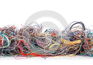 Colorful tangled threads isolated on white. Closeup