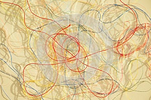 Colorful tangled threads on white surface. Abstract background