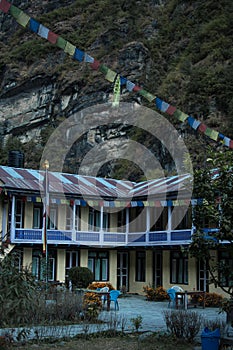 Colorful tea house lodge with prayer flags in Dharapani