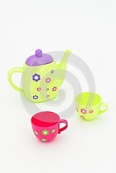 Colorful tea-set toy isolated on white background