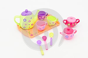 Colorful tea-set toy isolated on white background