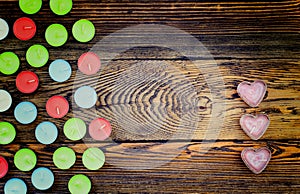 Colorful Tealight Candles on Wooden Background