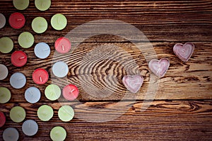 Colorful Tealight Candles on Wooden Background