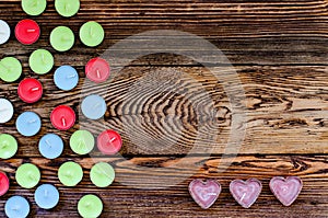 Colorful Tealight Candles on Wooden Background