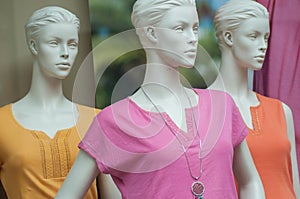 Colorful teeshirt on mannequin in fashion store for women showroom photo