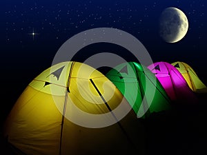 Colorful tent glows under a night sky with moon and full of star