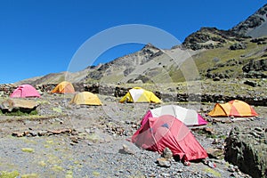 Colorful tents stanging in high mountain camping photo
