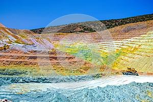 Colorful terraces of geological mine in Milos island.