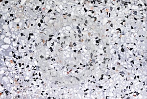 Colorful terrazzo or multicolored polished stone floor on grey background