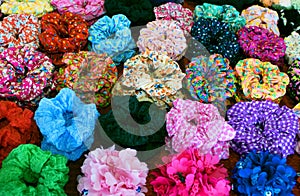 Bright colorful textile scrunchy. Hair bands. Filtered image