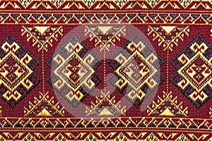 Colorful thai silk handcraft peruvian style rug surface close up