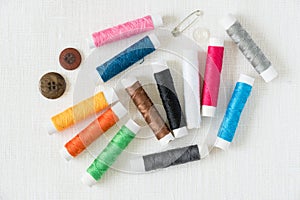 Colorful thread bobbins sewing concept image top view