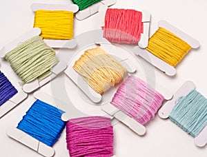 Colorful Thread Wound on Cardboard Flats Displayed Randomly