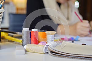 Colorful threads in costume studio for idea drawing sketches of fashion design