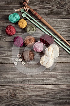 Colorful threads iris on wooden background.