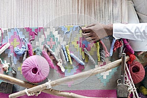 Colorful threads on a loom for traditional Panja dhurrie weaving  Salawas village  Rajasthan  India