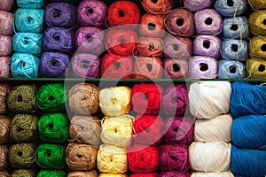 Colorful threads. Selection of colorful yarn wool on shopfront. Knitting background, a lot of balls. Knitting yarn for