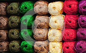 Colorful threads. Selection of colorful yarn wool on shopfront. Knitting background, a lot of balls. Knitting yarn for