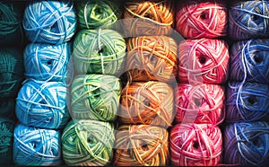 Colorful threads. Selection of colorful yarn wool on shopfront. Knitting background, a lot of balls. Knitting yarn for