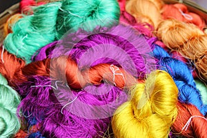 Colorful threads of Thai silk closeup for background.