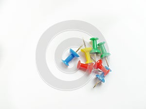 Colorful thumbtack againts white background