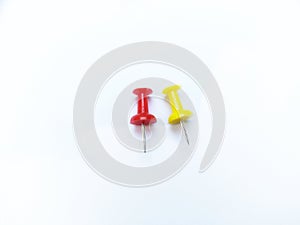 Colorful thumbtack againts white background