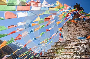 Colorful tibetan flags and snow mountain at Siguniang scenic area in China