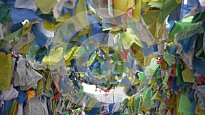 Colorful Tibetan prayer flags swaying in the wind in the temple, Ulan Ude Russia