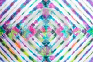 Colorful tie dye pattern hand dyed on cotton fabric abstract background