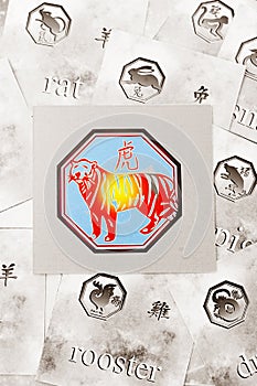 Colorful tiger signs among gray chinese astrological signs like the year of tiger