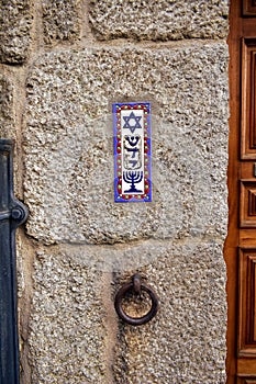 Colorful tile Mezuzah with Star of David and Menorah. Jewish Sephardic Quarter, Ribadavia, Spain.