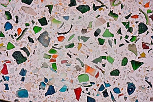 Colorful of tile-shard mosaic and stone decorating on the wall for background