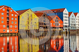 Colorful timber houses surrounding river Nidelva in the Brygge district of Trondheim, Norway
