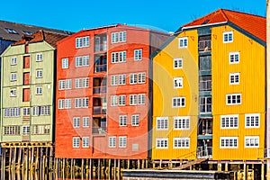 Colorful timber houses surrounding river Nidelva in the Brygge district of Trondheim, Norway