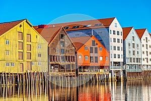 Colorful timber houses surrounding river Nidelva in the Brygge district of Trondheim, Norway