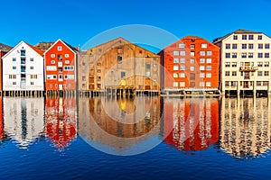 Colorful timber houses surrounding river Nidelva in the Brygge district of Trondheim, Norway