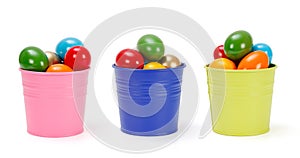 Colorful tin pails with Easter eggs