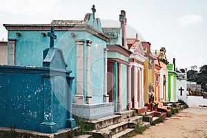 Colorful tombs in a row on the cemetery in Chichicastenango, Guatemala.