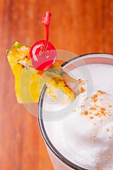 Colorful toned cocktails on wooden background. Frutal alcoholic cocktails. Colorful drinks concept on wooden table photo