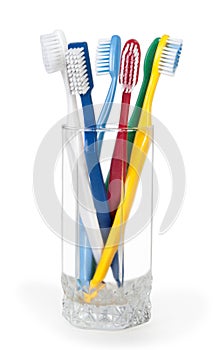 Colorful toothbrushes in a glass