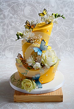 Colorful topsy turvy wedding cake