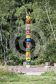 Colorful totem pole in the forest